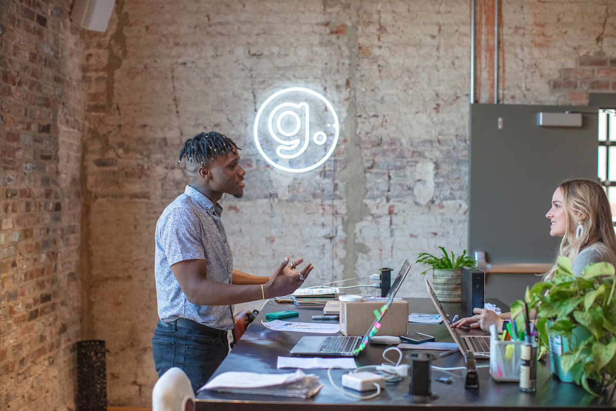 Community manager answering a member's questions