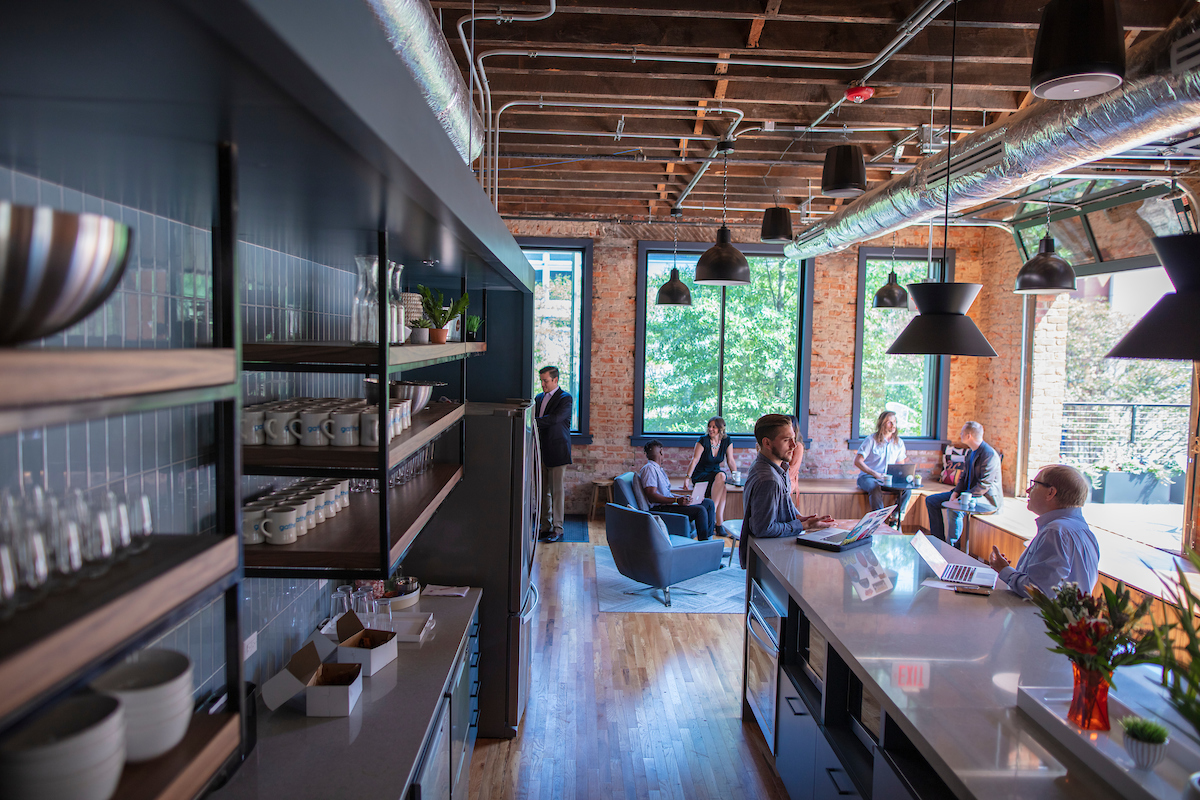 Gather Richmond Co-workers Walking Down Glass Hallway of Offices