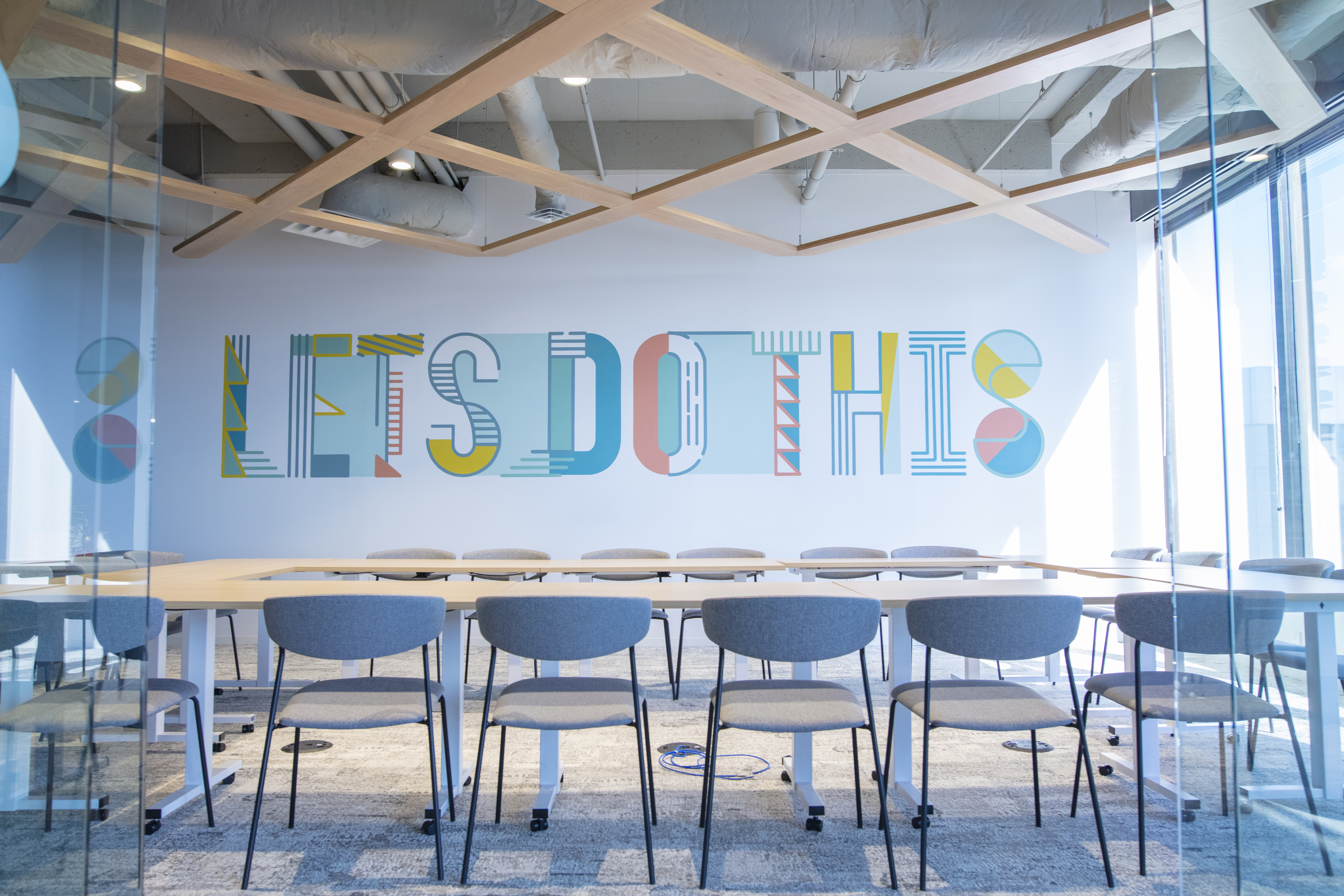Gather Richmond Co-workers Walking Down Glass Hallway of Offices